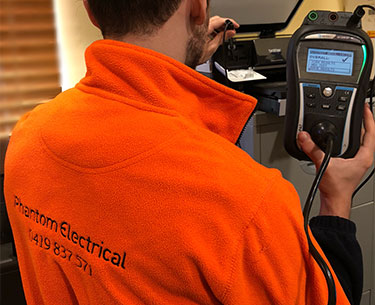 Phantom Electrical technician performing test and tag on electrical appliances